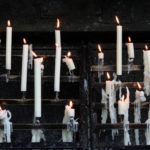 a host of candles burning
