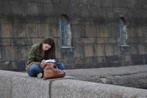 Girl reads a book in St. Petersburg, Russia