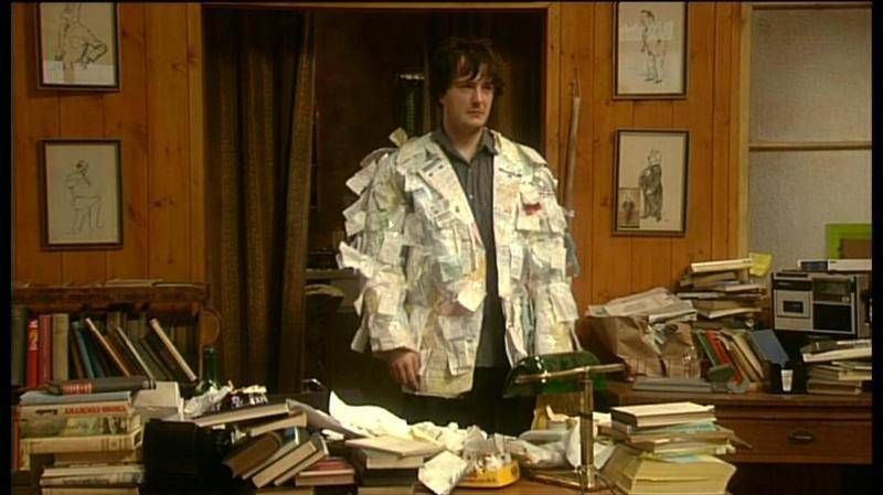 Bernard Black wearing a jacket made of receipts