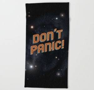 Bookish beach towels - this classic Hitchhiker's Guide to the Galaxy towel will remind you not to panic no matter what situation arises.