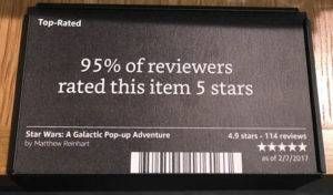 black placard attached to a table that says "95% of reviewers rated this item 5 stars."
