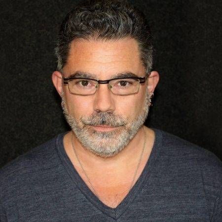 head shot of audiobook narrator with gray beard and glasses