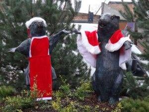 Mr. and Mrs. Beaver statues in the C.S. Lewis Square in Belfast - They are outfitted in Santa hats and cloaks