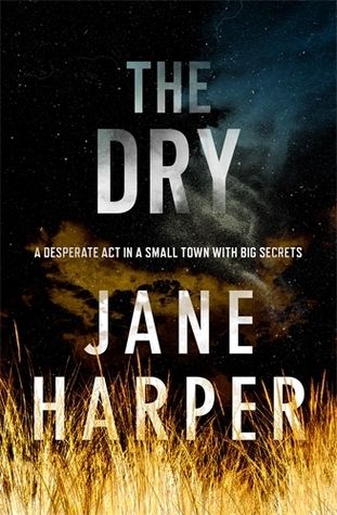 cover of the dry by jane harper, an image of dry tall grass lit up in headlights at night