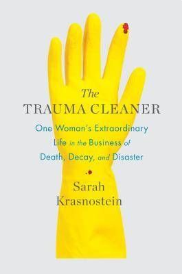 the trauma cleaner cover image: yellow latex glove on white background with spot of blood on index finger tip
