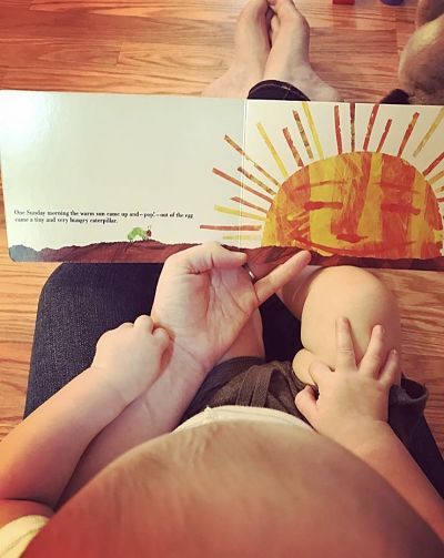 Contributor Dana Staves reads with her child, shared in celebration of bookish moms for Mother's Day