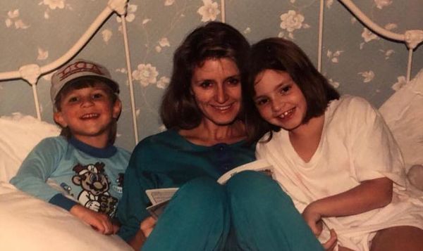 Contributor Emily Martin reads with her mother and brother as a child, shared in celebration of bookish moms for Mother's Day