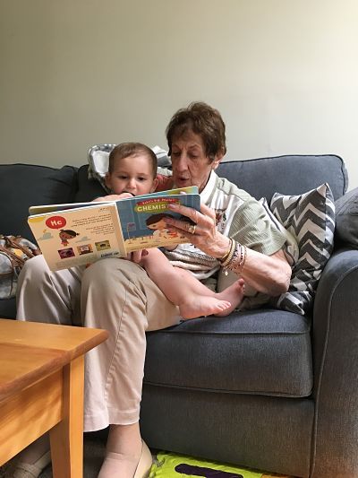 Contributor Jaime Herndon's grandmother reads to her child, shared in celebration of bookish moms for Mother's Day