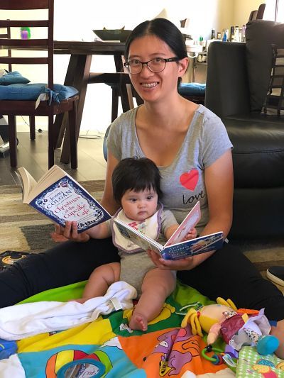 Contributor Jen Sherman reads with her child, shared in celebration of bookish moms for Mother's Day