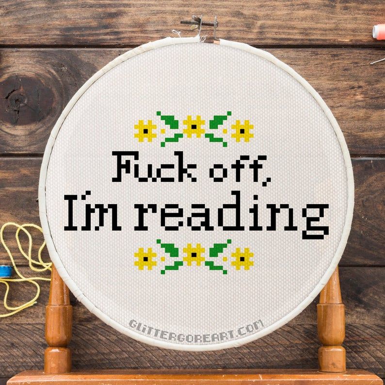 Cross stitch of "Fuck off, I'm reading"