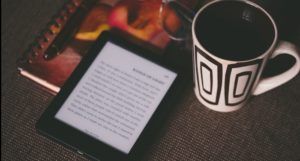 image of an reader and coffee mug