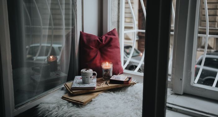 a photo of a cozy reading nook with a book