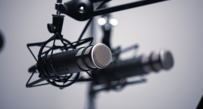 a photo of a microphone for podcasts and audiobooks feature 700x375