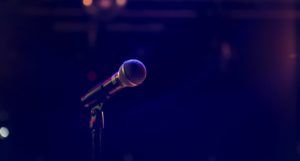 a photo of a microphone on stage