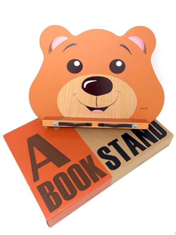 Bear face portable book stand. 'A book stand' is written in all caps. Link: https://i.etsystatic.com/21528433/r/il/af33ad/2295635680/il_794xN.2295635680_b0bc.jpg