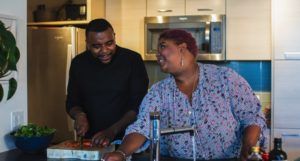 image of a Black man and plus size Black woman cooking in kitchen https://unsplash.com/photos/ce5ShWF9tAY