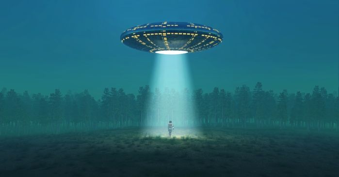 UFO abducting someone in a dark field