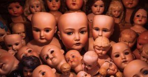 pile of doll heads