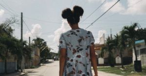 young black girl walking down the street