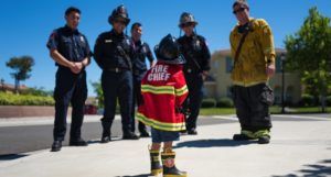 child pretending to be a firefighter