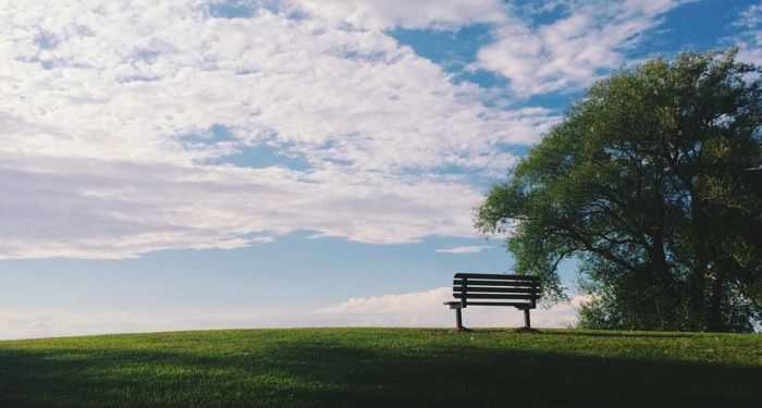 image of an empty bench on a hillside against a blue sky https://unsplash.com/photos/EBB45rCSjrU