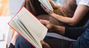 people reading together for book club