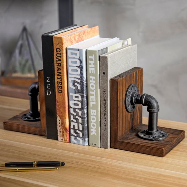 wood bookends with large metal industrial pipes mounted on them