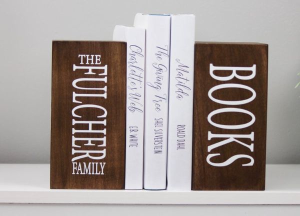 two wooden bookends with personalized "Fulcher family books"