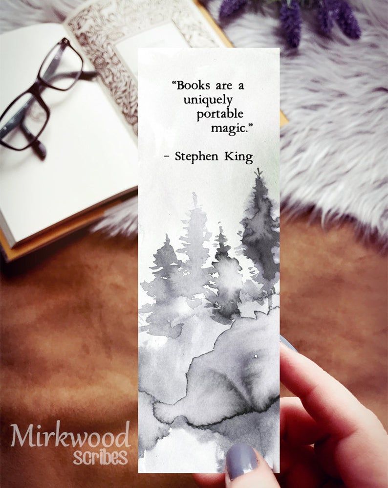 Forest watercolor bookmark with the Stephen King quote: "Books are a uniquely portable magic."