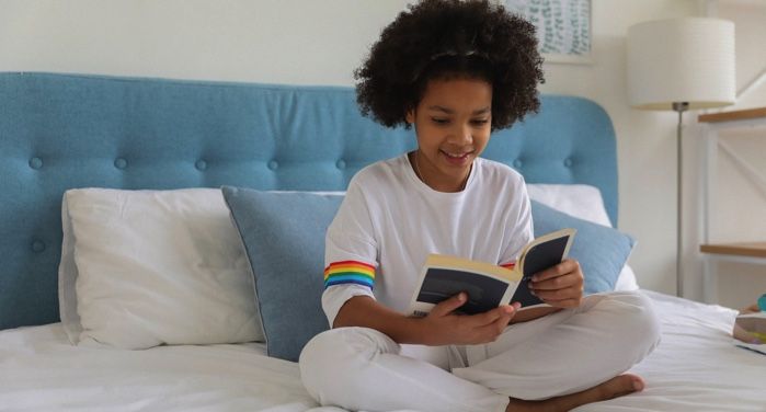 image of a young girl reading a book on a bed https://www.pexels.com/photo/black-girl-reading-book-on-bed-5063001/