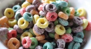 colorful froot loops breakfast cereal in a white bowl