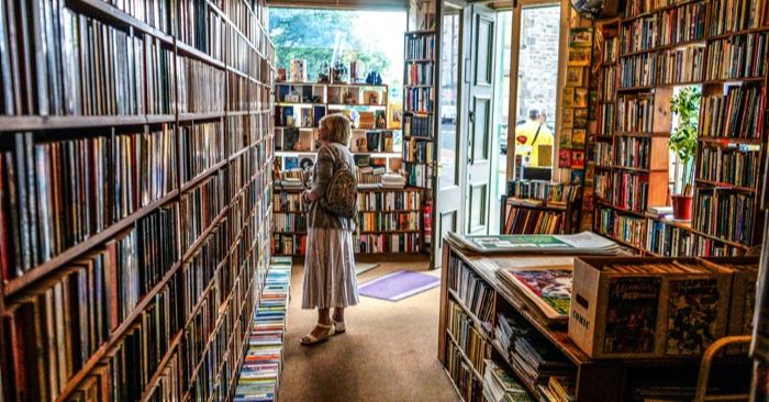 woman browsing books in bookstore
