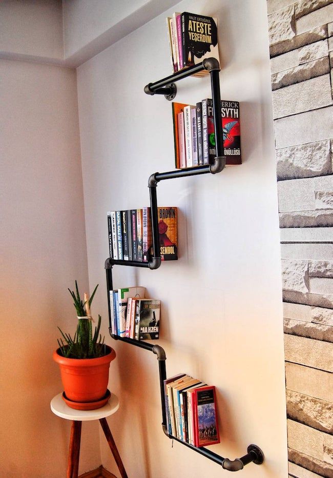 large iron pipe wall bookshelf