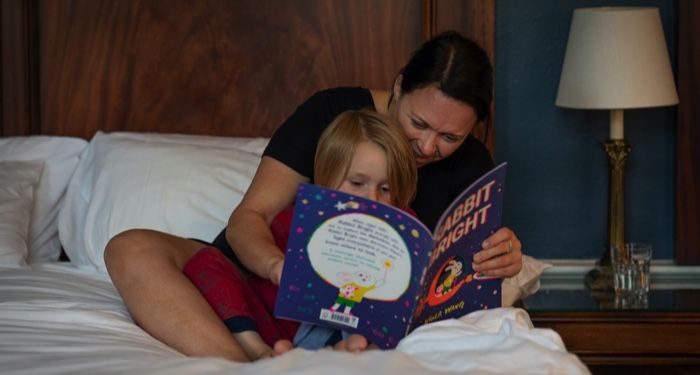 mother reading a bedtime book to her child