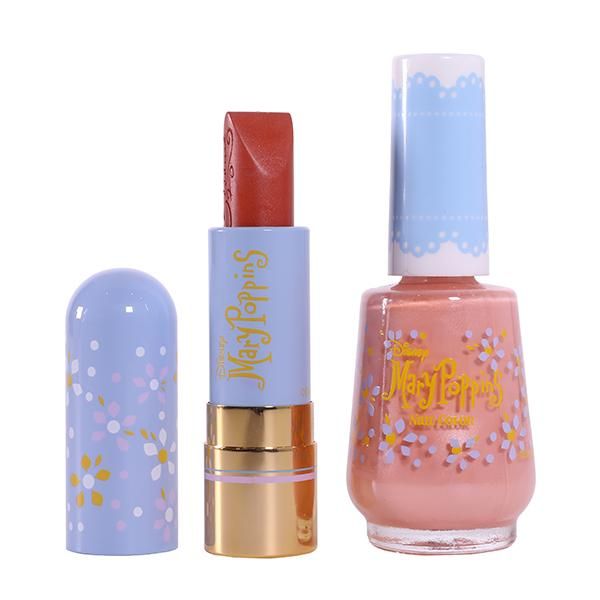 Lipstick with a blue Mary Poppins themed case next to pink nail polish