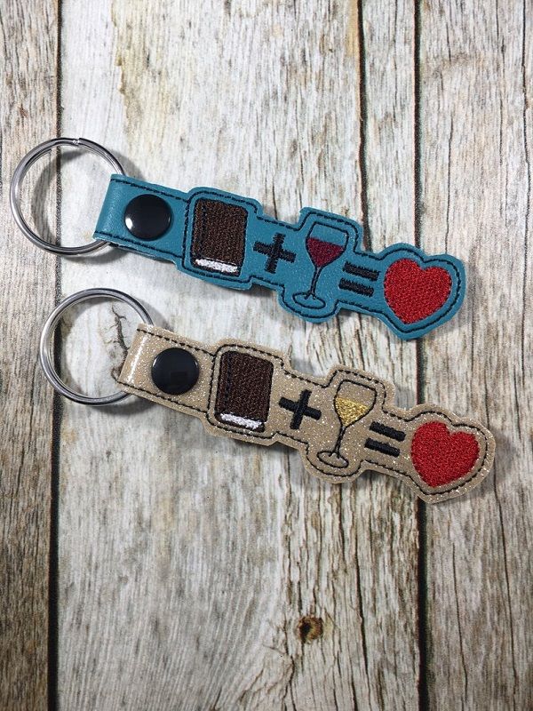 book and wine keychains