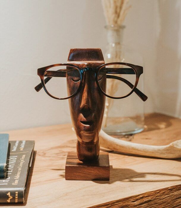 Wooden glasses holder shaped like a face
