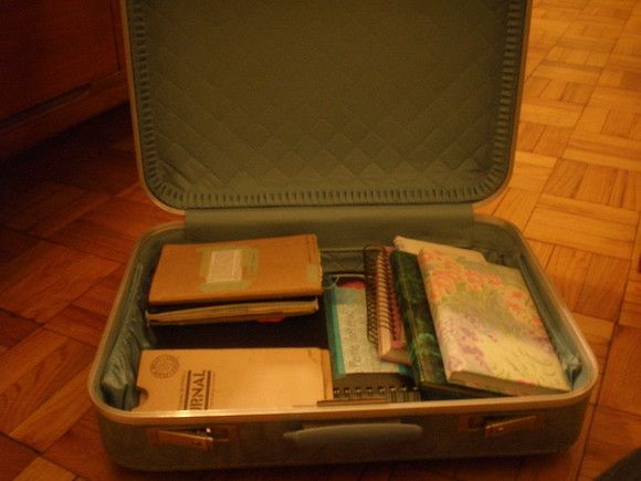 Vintage suitcase full of books