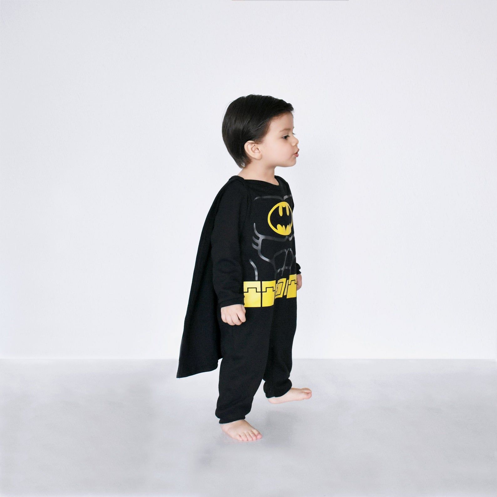 Image of a child in a Batman costume. 
