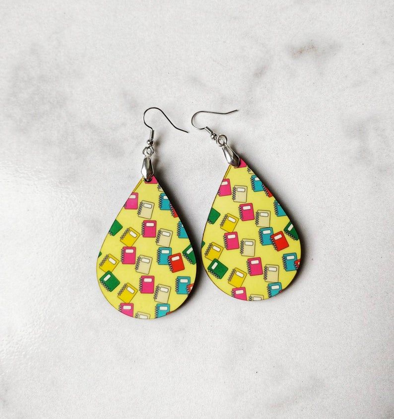 teardrop shaped earrings with colorful books