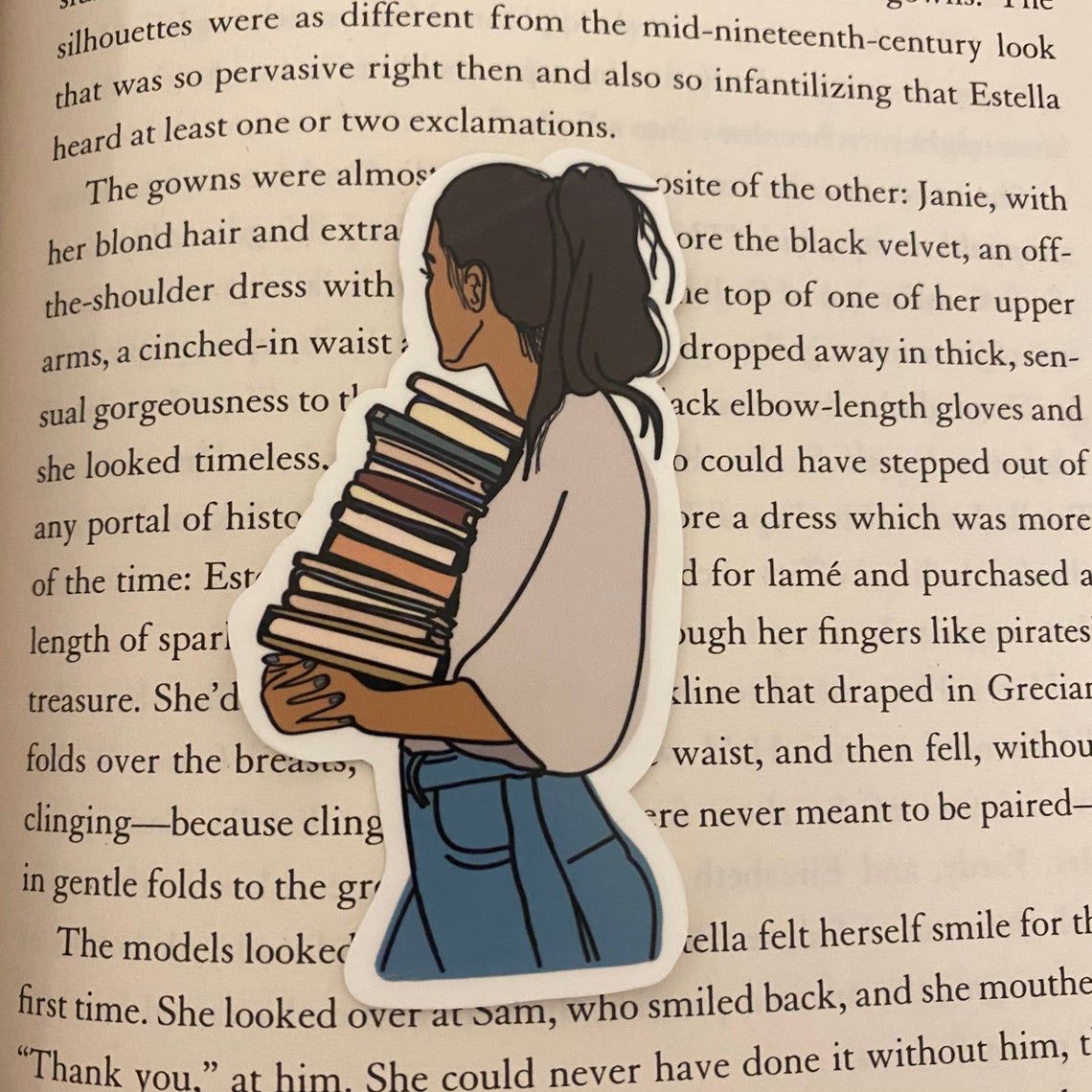 sticker depicting a person looking away over their shoulder holding a stack of books 