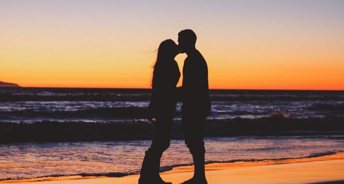 silhouette of a couple kissing on the beach at sunset https://unsplash.com/photos/JpUJqo8Le0s