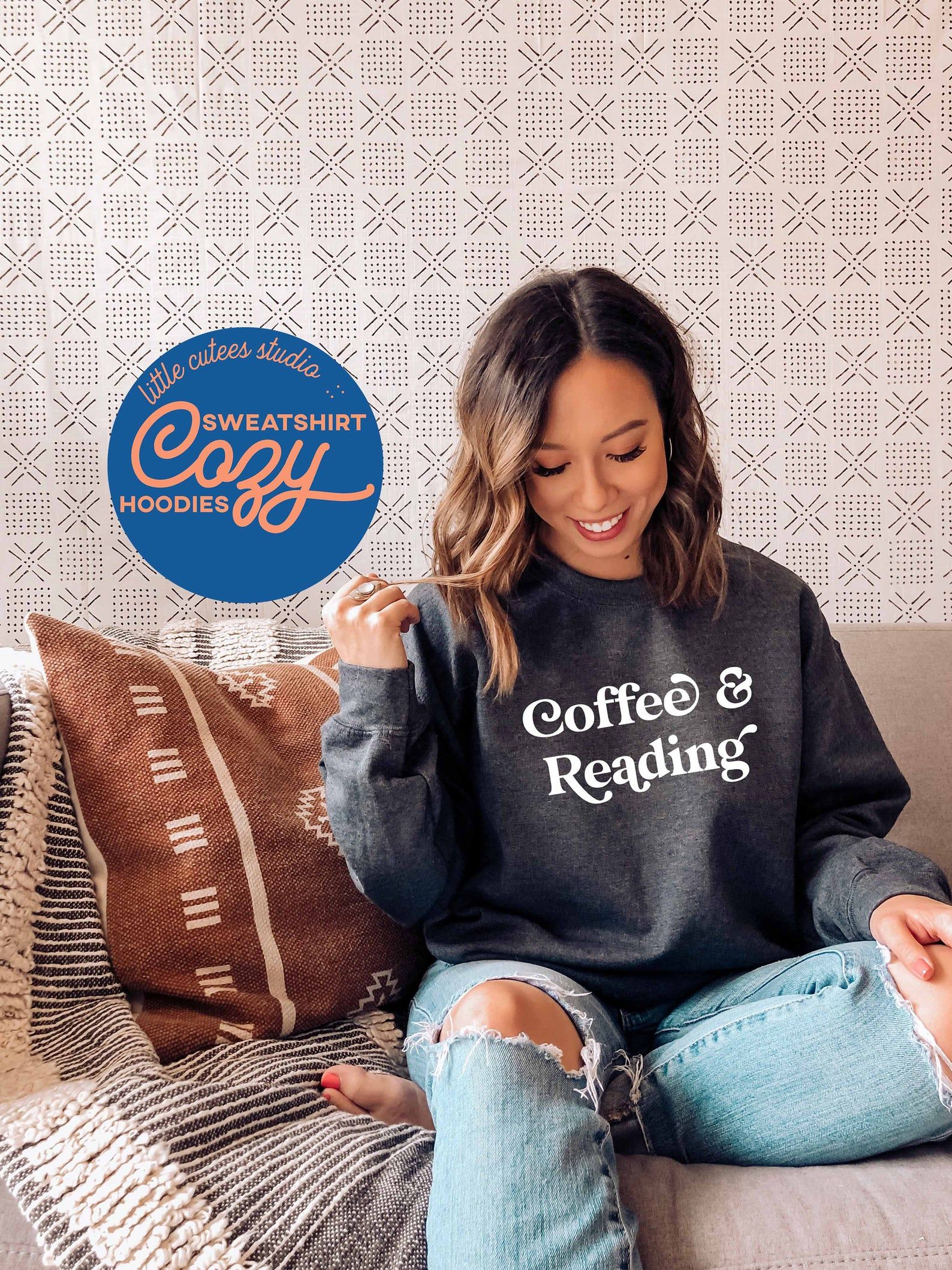 Image of a person in a gray sweatshirt reading 
"coffee & reading"