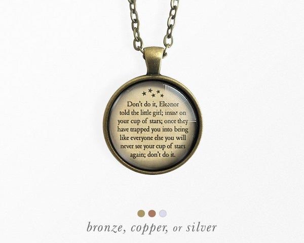 round pendant necklace with text from the haunting of hill house