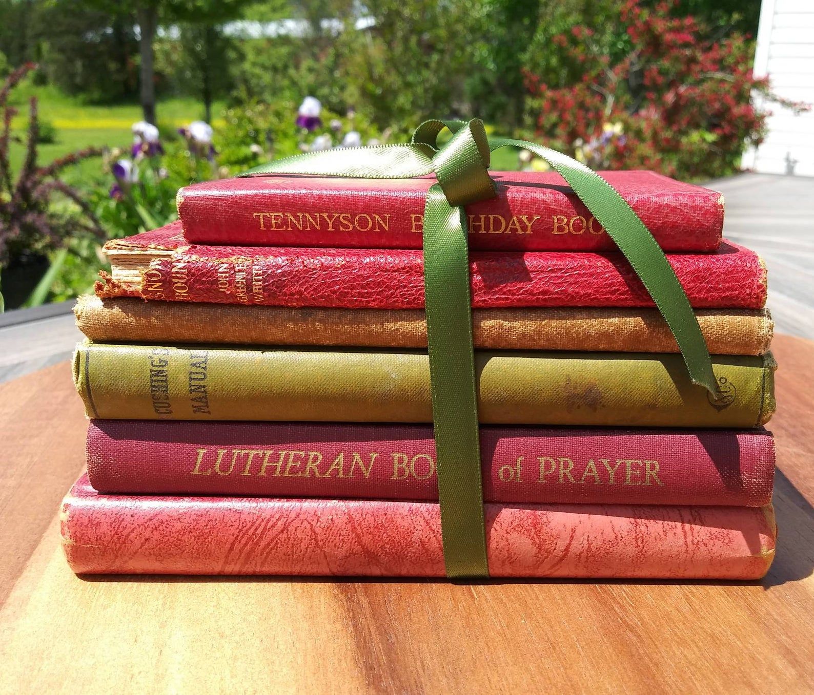 Image of a stack of red and yellow-green books. 