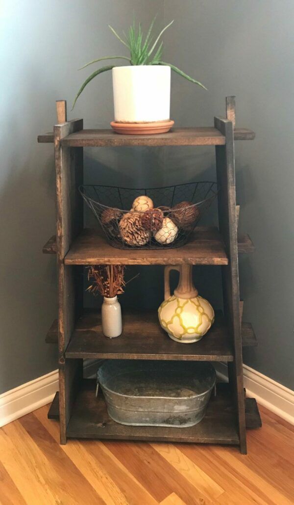 Small wooden bookcase filled with knickknacks