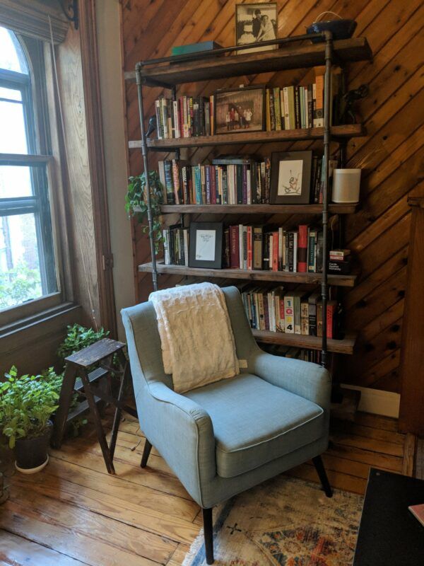 Tall open-sided reclaimed wood bookshelf
