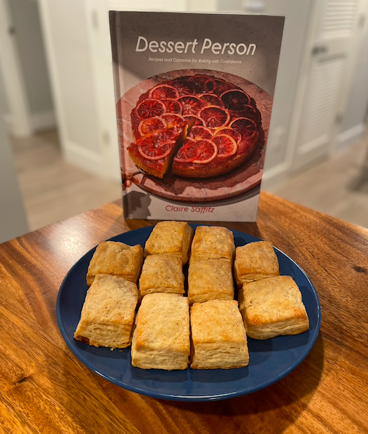 Dessert Person cookbook with plate of buttermilk biscuits