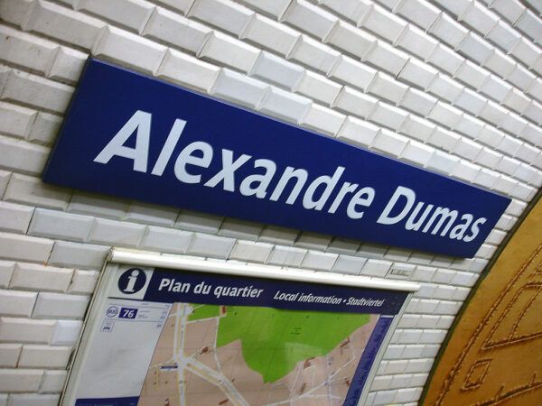 A sign reading Alexandre Dumas at a Paris metro station