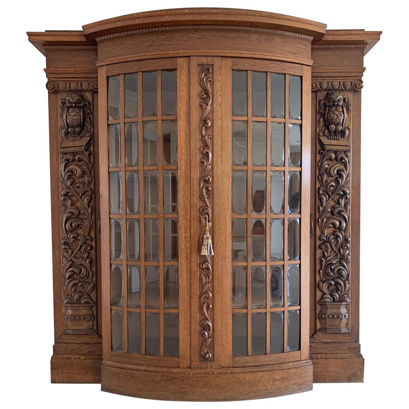 bookcase with owl carvings
